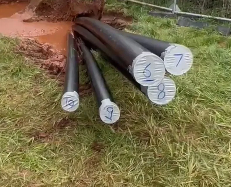 The installed HDPE cable ducts numbered off at the pit at Iron Acton